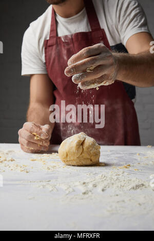cropped image of chef preparing dough in kitchen Stock Photo
