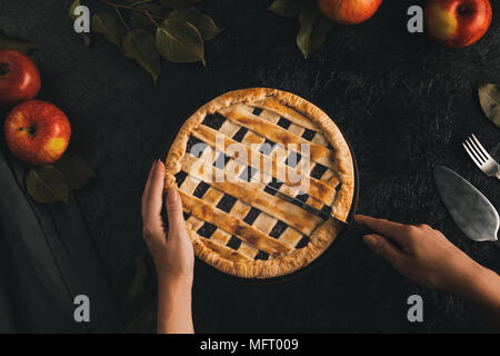 woman cutting apple pie Stock Photo