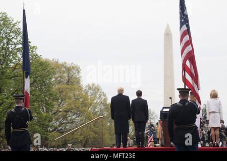 U.S President Donald Trump, left, and French President Emmanuel Macron during the formal arrival ceremony on the South Lawn of the White House April 24, 2018 in Washington, DC.  Macron is on a State Visit to Washington, the first since President Trump took office. Stock Photo