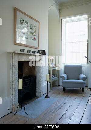 Upholstered Armchair Next To Fireplace In Neutral Colour Sitting