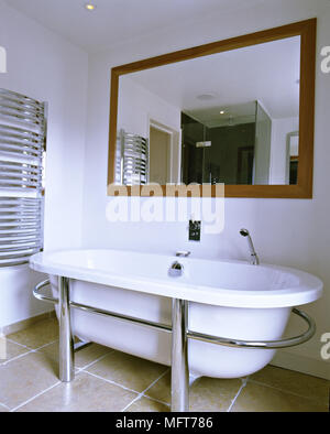 https://l450v.alamy.com/450v/mft786/a-detail-of-a-modern-bathroom-freestanding-bath-tub-stone-floor-chrome-towel-rail-radiator-mirror-mft786.jpg