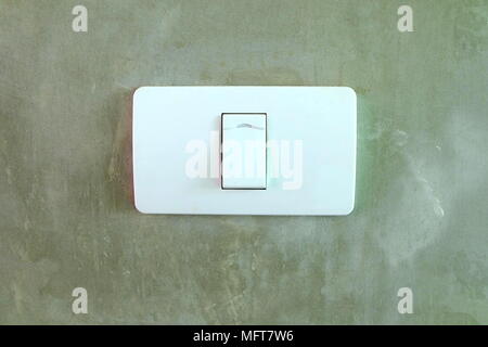 Electric Switch on Concrete Wall. Stock Photo
