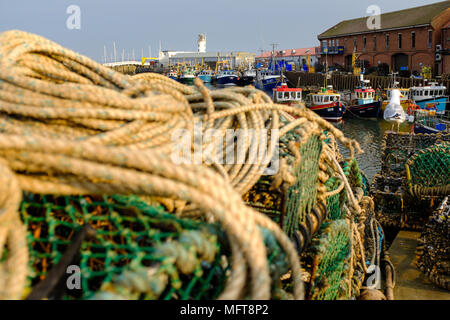 SCARBOROUGH, ENGLAND - APRIL 21: Scarborough fishing boats, and equipment in the harbour on a beautiful warm evening. In Scarborough, England. On 21st Stock Photo