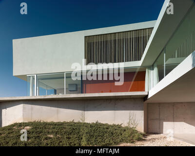 Exterior of modern house on different levels  with red painted wall Stock Photo