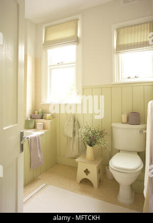 View into country style bathroom with wood panelling Stock Photo
