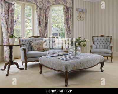 Upholstered table in front of period sofa Stock Photo
