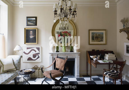 Writing desk next to fireplace in traditional style drawing room Stock Photo