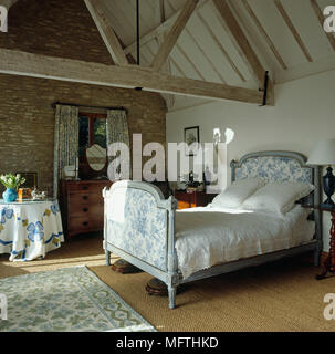 Antique French bed in country style bedroom Stock Photo