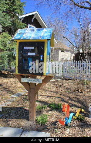 Little free library which gives books away for free to passersby. Stock Photo