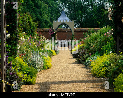 Garden with gravel path through walled garden, Coughton Court, Warwickshire, UK Stock Photo