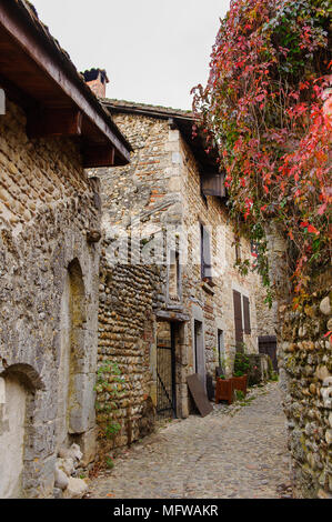 Narrow street in Perouges, France, a medieval walled town, a popular ...