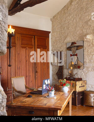 Laptop on wooden table in country style room Stock Photo