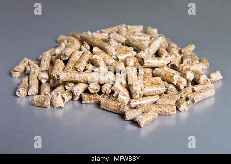 Wood pellets on a silver background. Biofuels. The Cat Litter Stock Photo