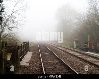 Wessex main line railway tracks at West Dean station serving Southampton to Salisbury via Romsey, taken on early misty spring morning Stock Photo