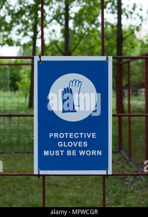 Protective safety gloves must be worn, mandatory sign. Stock Photo