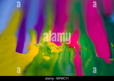 colorful of plastisol ink are dripping by in opposite directions Stock Photo