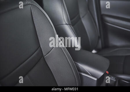 Car seat in modern luxury comfortable car with the black perforated leather Stock Photo