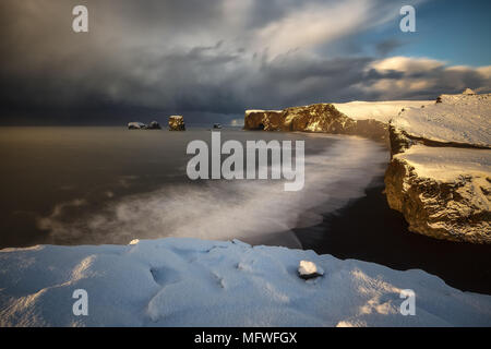 Dyrholaey cape over black sand beach in Iceland Stock Photo