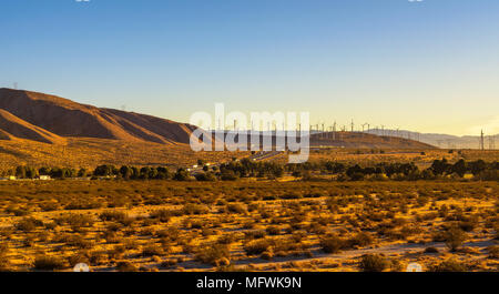 Windmills along a highway in Mojave desert, California Stock Photo