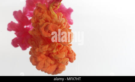 Pink and orange smoke clouds over white background Stock Photo