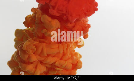 Orange and red smoke cloud over white background Stock Photo