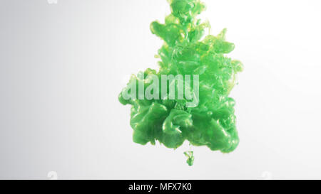 Green ink, smoke clouds over white background Stock Photo