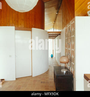 Spacious retro style hallway with curving wall Stock Photo