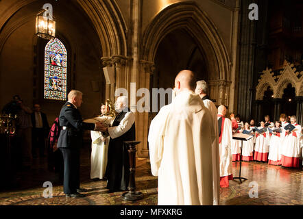 Dublin, Ireland. 26/4.2018. The Return of the Heart of St. Laurence O'Toole. Assistant Commissioner of the Gardai (police), Pat carries the heart of ST Laurence O' Toole, to the Archbishop of Dublin, the Most Revd Dr. Michael Jackson, at a service in Christ Christ Church Cathedral, in Dublin, to celebrate its return after it was stolen by persons unknown in 2012. Laurence O'Tole was a former Archbishop of Dublinand died in 1180. He was made a saint in 1226. Photo: Eamonn Farrell/RollingNews.ie Credit: RollingNews.ie/Alamy Live News Stock Photo
