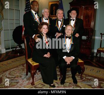 Washington, District of Columbia, USA. 5th Dec, 1998. Recipients of the 1998 Kennedy Center Honors pose for a group picture December 5, 1998 at the Department of State in Washington, DC. (L-R Standing) Bill Cosby, John Kander, Fred Ebb and Willie Nelson, (L-R sitting) Shirley Temple Black and Andre Previn. Each year the Kennedy Center Honors celebrate the lifetime achievements of America's greatest performing artists with a star-studded evening of song, dance, and tribute. Credit: George De Keerle- Pool/CNP Credit: George De Keerle/CNP/ZUMA Wire/Alamy Live News Stock Photo