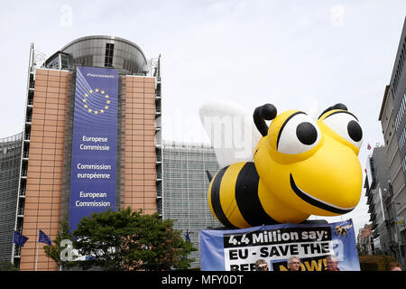 Brussels, Belgium. 27th April 2018. A giant inflated model of a bee during a demonstration in front of the European Commission offices calling the EU to adopt a ban on bee-killing neonicotinoid pesticides. Alexandros Michailidis/Alamy Live News Stock Photo