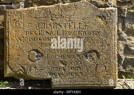 broken gravestone in the old cemetery close to Stock Photo