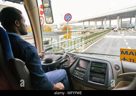 MILAN MALPENSA, ITALY - CIRCA NOVEMBER, 2017: Airport Bus Express driver drive a bus from Malpensa airport to Milan. Stock Photo