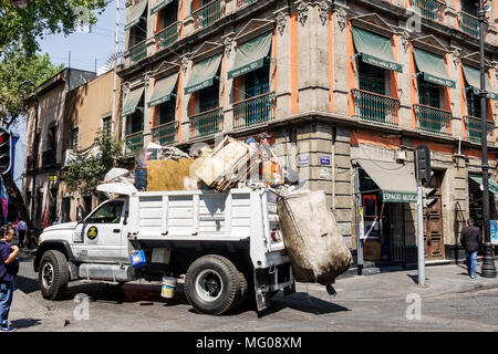 Mexico City,Mexican,Hispanic,historic Center Centre,Calle Bolivar,waste trash collection,garbage truck,man men male,sanitation worker,turning corner M Stock Photo