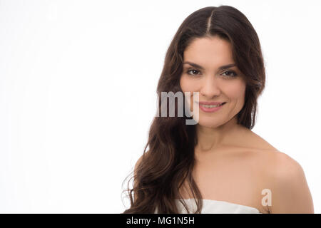 Beautiful brunette middle-aged woman wearing spring colorful dress