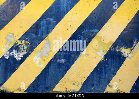 Old Black and Yellow Striped Caution Sign. Stock Photo