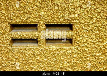 Outlet on Golden Painting Concrete Wall. Stock Photo