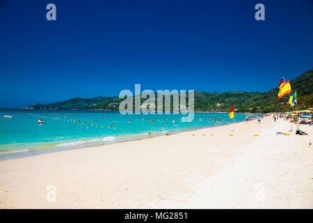 Tourists at Patong beach in Phuket, Thailand. Phuket is a popular destination famous for its beaches. Stock Photo