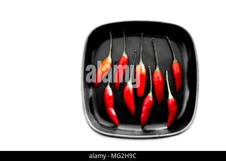 Brown square plate with 9 red Chillis Stock Photo