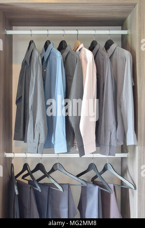 Colorful Wooden Cloth Hangers On Clothes Rail In White Wardrobe Stock  Photo, Picture and Royalty Free Image. Image 43816766.