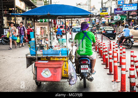 PHUKET, THAILNAD-JAN 24, 2016: Food vendor on motorcycle in Patong on Jan 24, 2016, Phuket. Thailand. Stock Photo