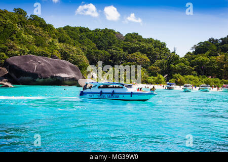 PHUKET, THAILAND - JAN 25, 2016: Speed boat  with four engines full of tourists at Koh Miang  beach on Jan 25, 2016, Thailand. Stock Photo