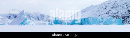 Icebergs frozen into the fjords of Baffin Island, Nunavut, Canada Stock Photo