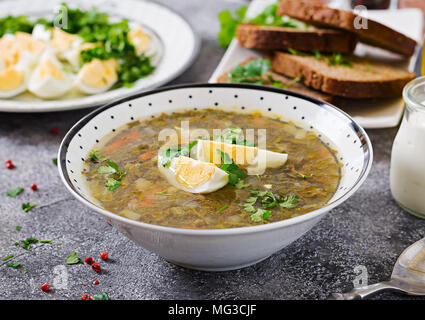 Green sorrel soup with eggs. Summer menu. Healthy food. Stock Photo