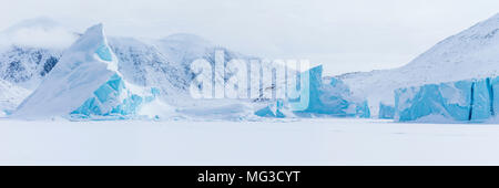 Icebergs frozen into the fjords of Baffin Island, Nunavut, Canada Stock Photo