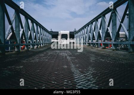 Diamond Plate Pathway to Pier. Stock Photo