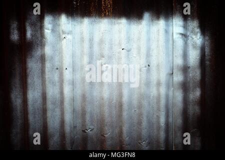 Bronze Color Spray Paint on Old Zinc Wall Background. Stock Photo