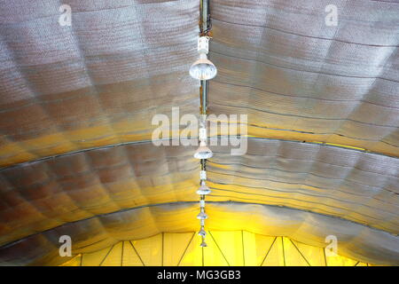 Hanging Lamps inside Big Tent with Heat Shield. Stock Photo