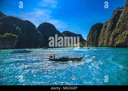 PHI PHI , THAILNAND-JAN 27, 2016: Boats at Maya beach in Ko Phi Phi island on jan 27, 2016, Thailand. Stock Photo