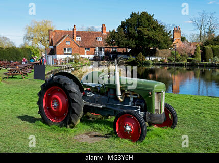 Vintage tractor next to the Mill House pub & restaurant, North Warnborough, Hampshire, England UK Stock Photo