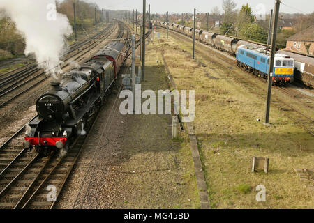 Preserved LMS Stanier class 8F steam locomotive no. 48151 and Class 86 loco 86259 'Les Ross' at Holgate sidings, York, UK. Stock Photo